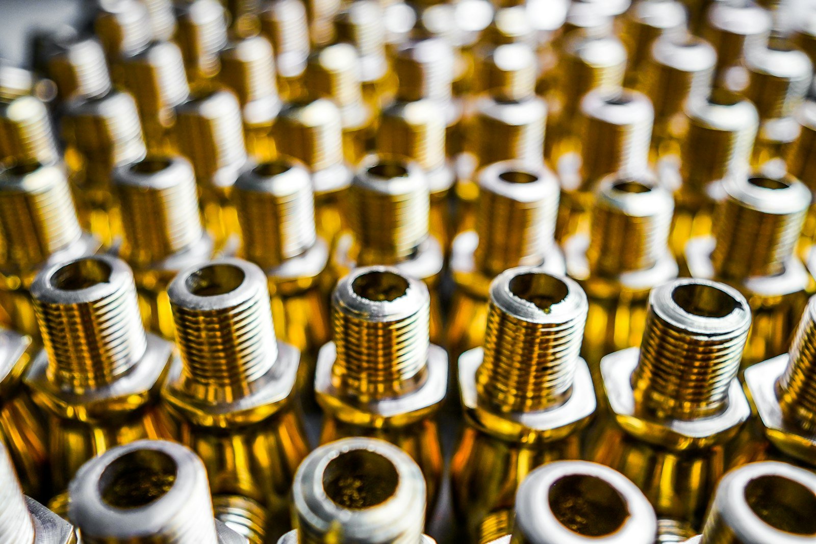 Various brass, bronze, and copper metal samples showing color differences